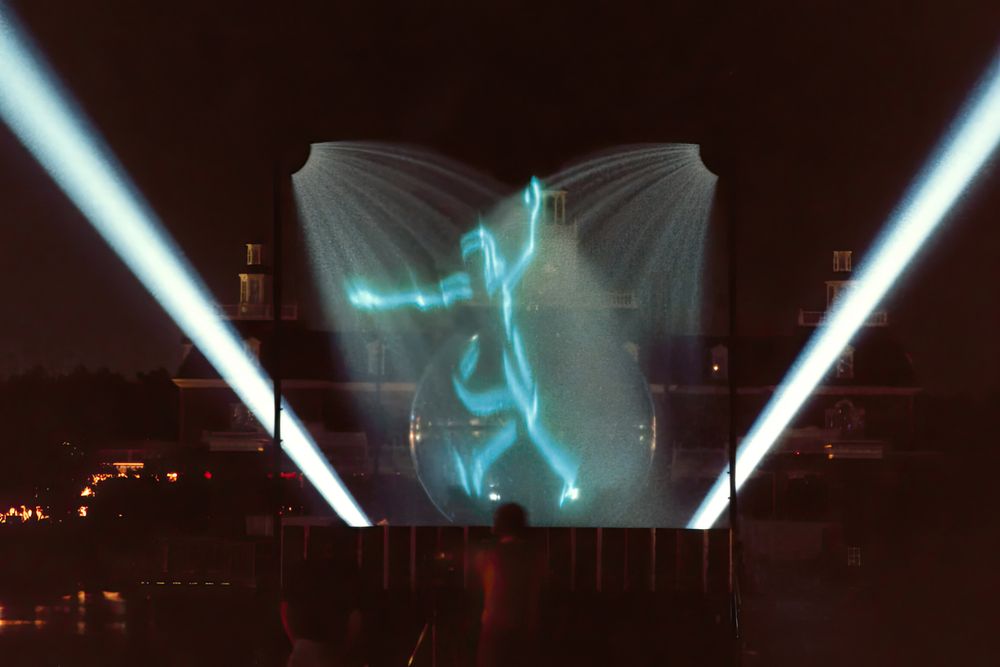 The Skater, a laser figure projected on a water-droplet screen above the Epcot lagoon